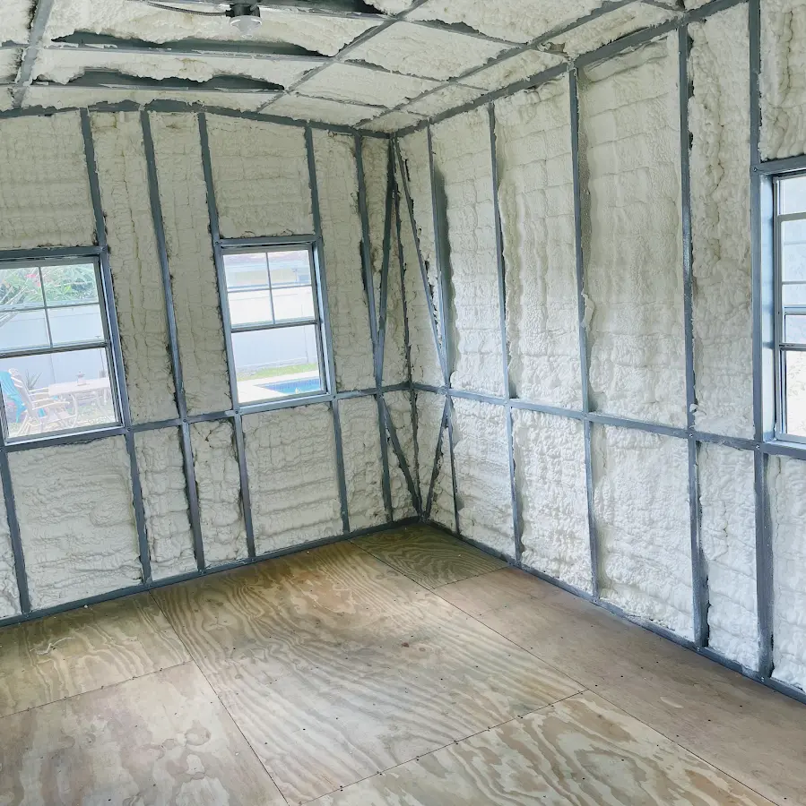 Closed-cell spray foam insulation applied to wall cavities in a residential project in Haddon